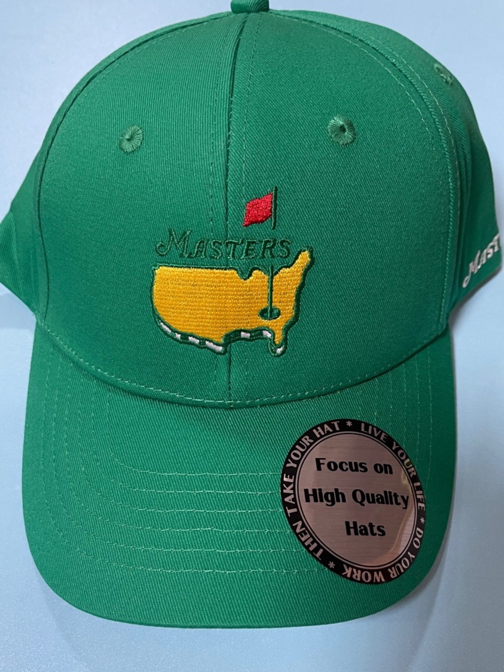 Masters Green Hat with Yellow & Red Logo